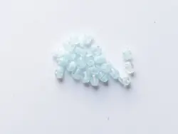 Mačkané skleněné korálky oliva (ovál) 8 × 6 mm, 23 ks světlá královsky modrá mramor
