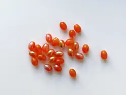 Mačkané skleněné korálky oliva (ovál) 8 × 6 mm, 23 ks Oranžová  AB pokov