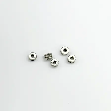 Kovový korálek - mezidíl tibetský váleček  6*3mm