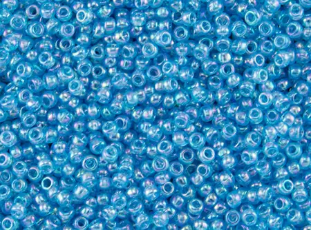 Rokajlové korálky Toho  - Round 15/0 : Transparent-Rainbow Aquamarine TR-15-163