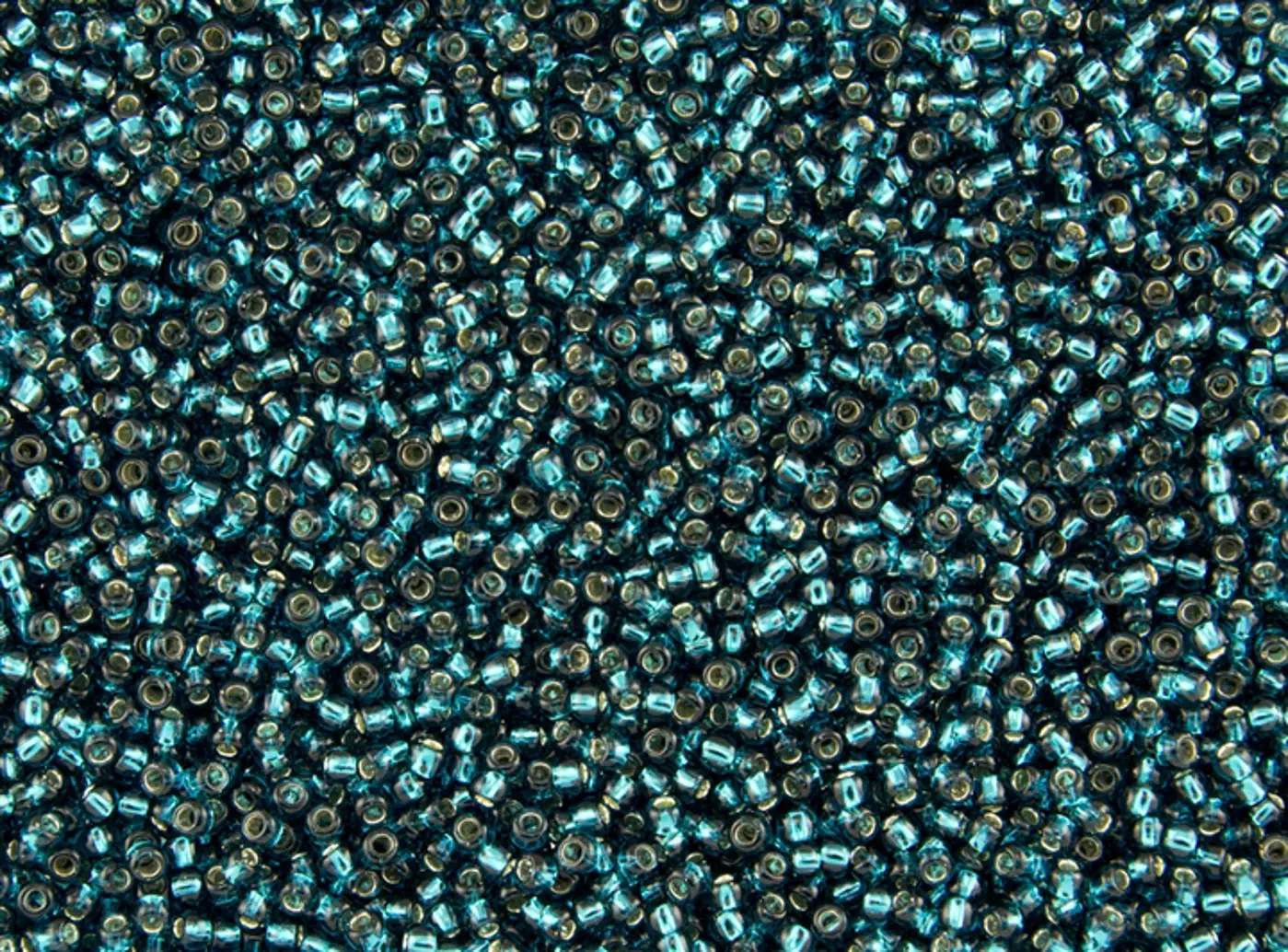 Rokajlové korálky Toho  - Round 15/0 : Silver-Lined Teal TR-15-27BD - fotografie 1