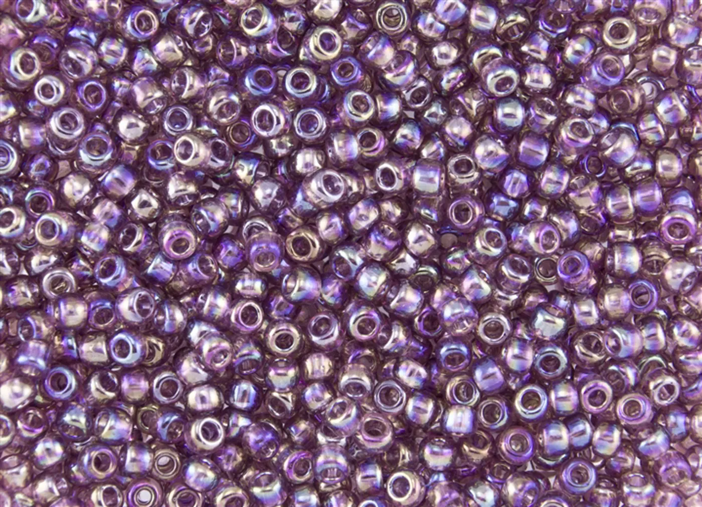 Rokajlové korálky Toho  - Round 15/0 : Transparent-Rainbow Med Amethyst TR-15-166B  - fotografie 1