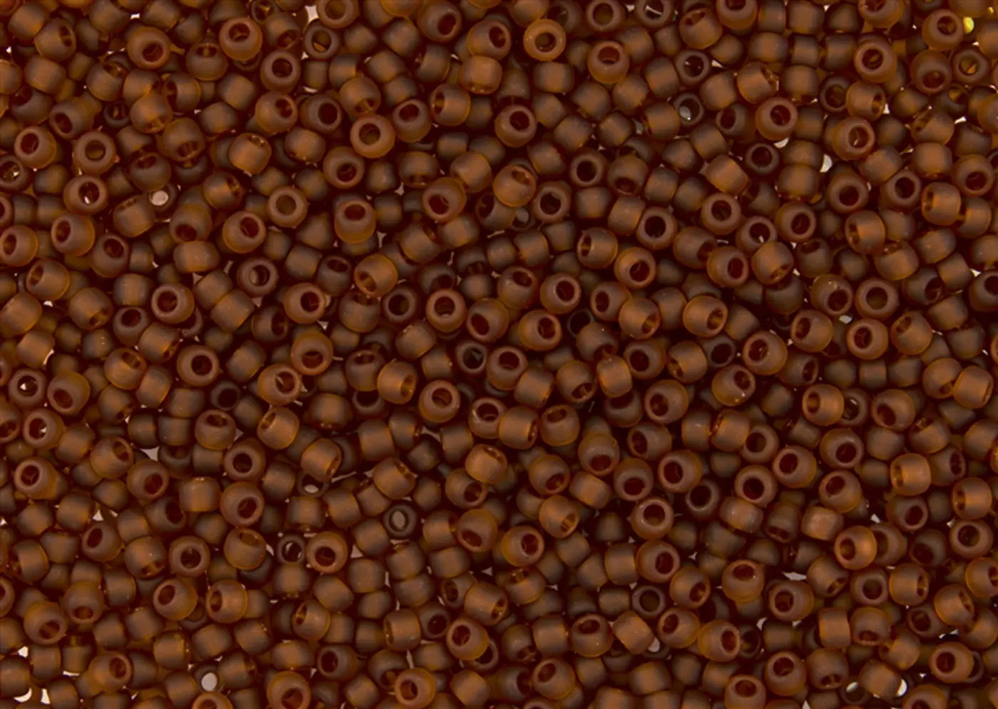 Rokajlové korálky Toho  - Round 15/0 : Transparent-Frosted Umber TR-15-941F - fotografie 1