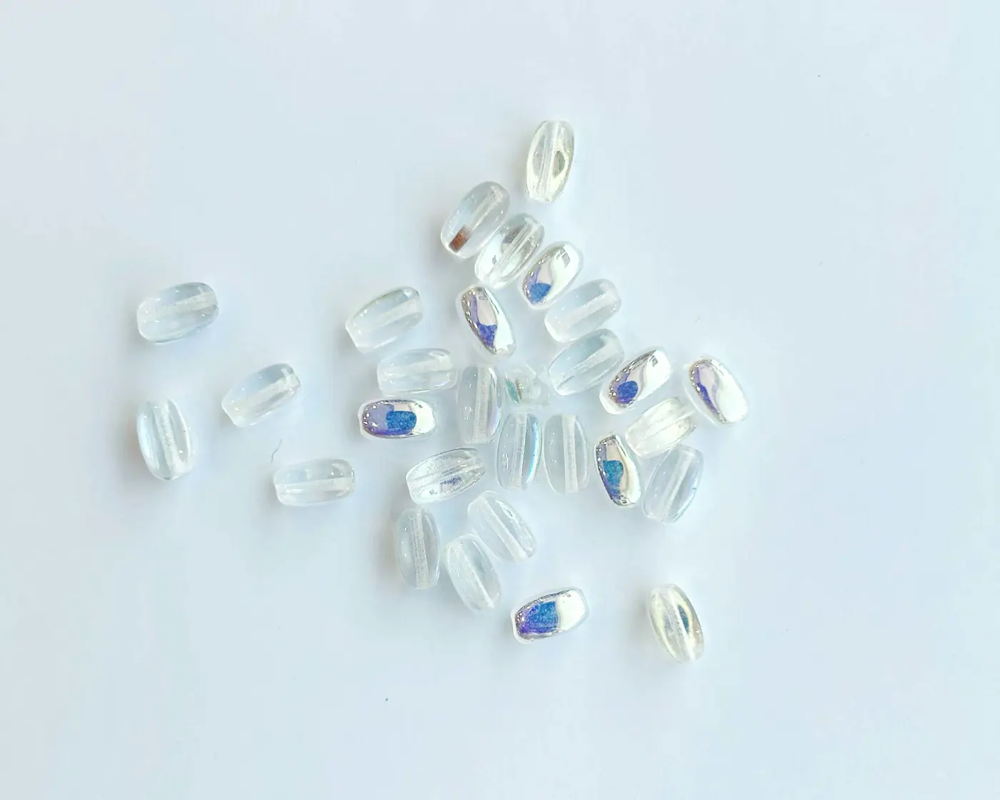 Korálek mačkaný ZRNKO 9/5mm crystal AB - fotografie 1