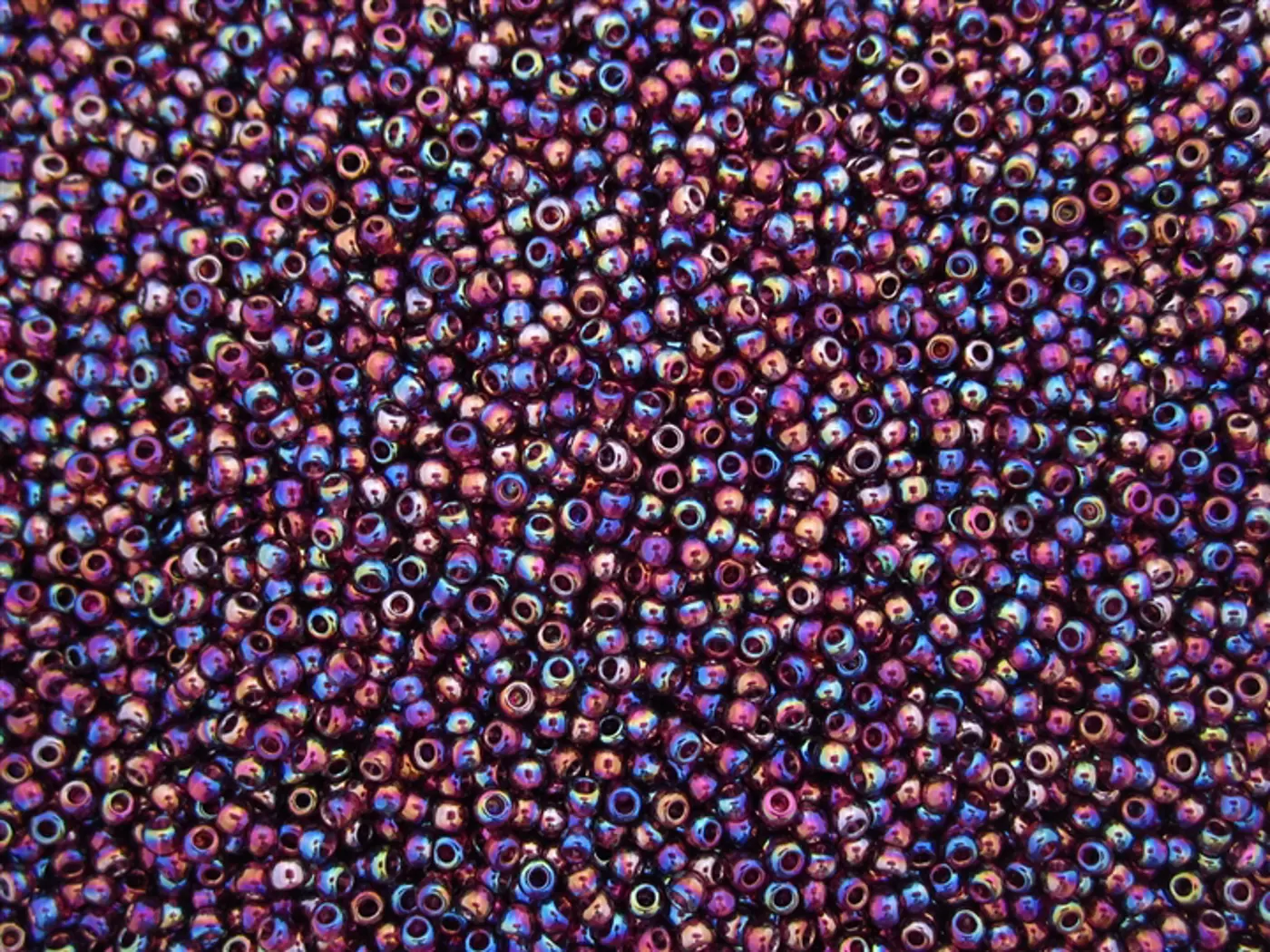 Rokajlové korálky Toho  - Round 15/0 : Transparent-Rainbow Amethyst TR-15-166C  - fotografie 1
