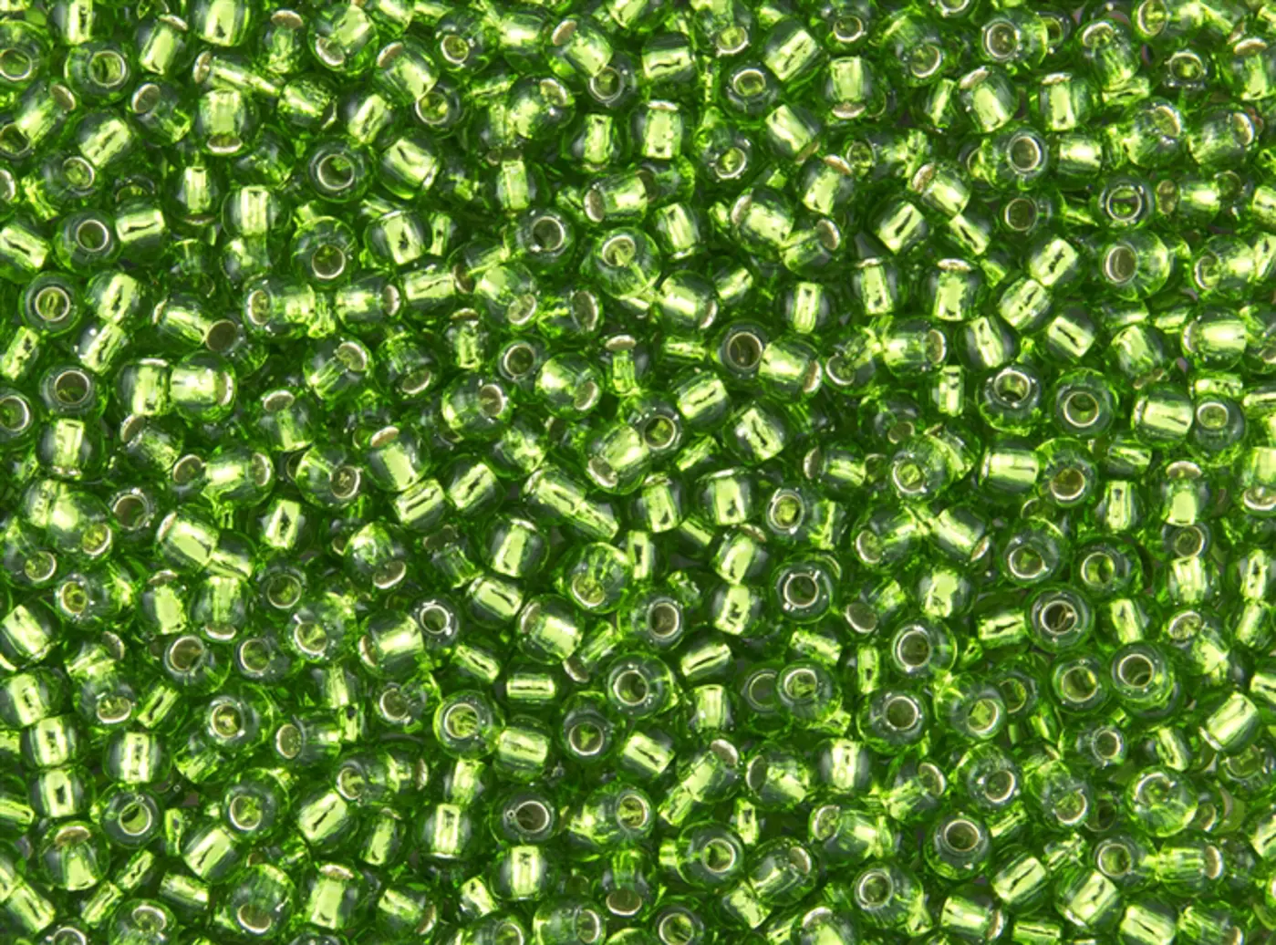 Rokajlové korálky Toho  - Round 15/0 : Silver-Lined Peridot TR-15-27 - fotografie 1
